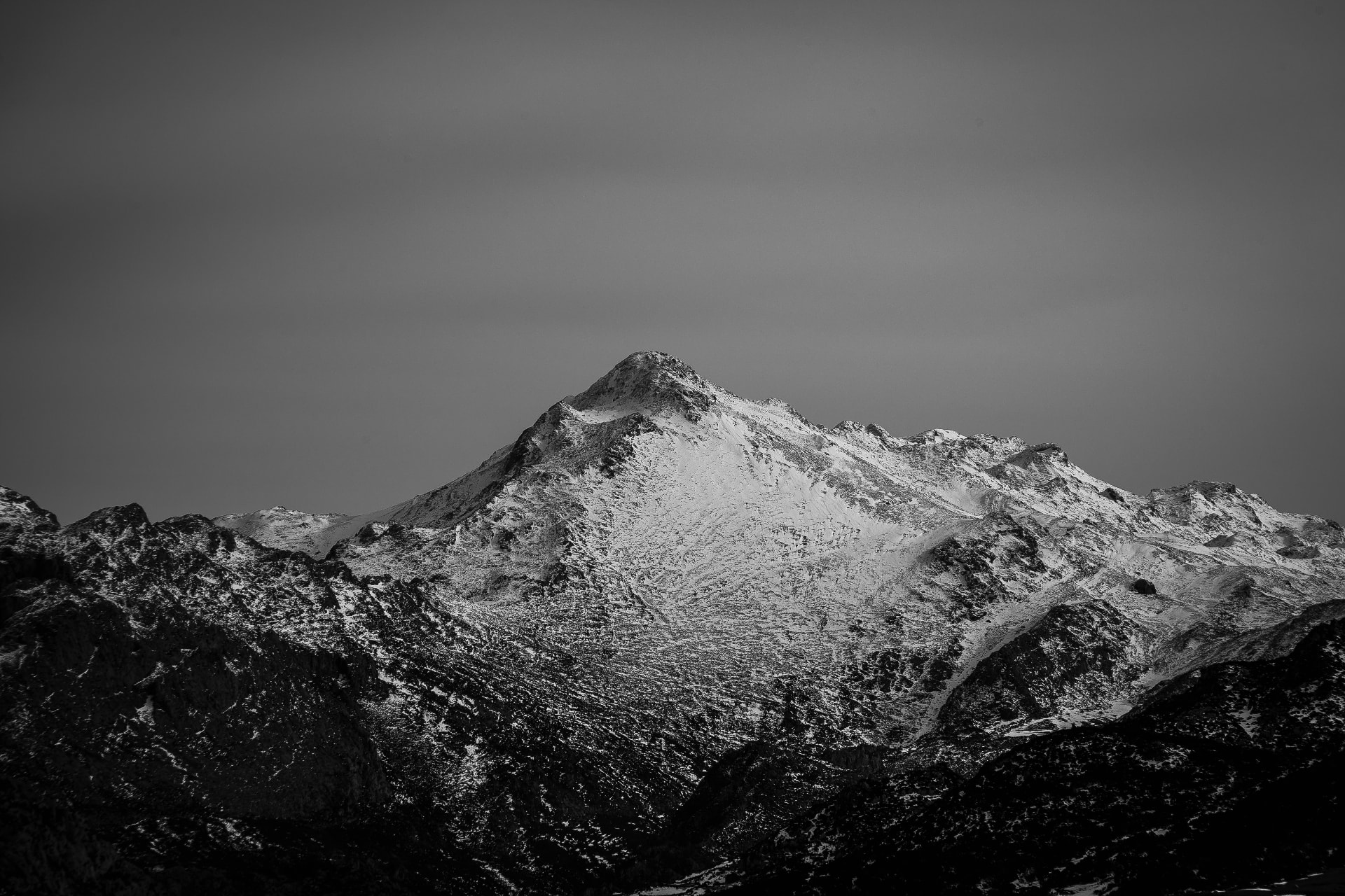 Snow-covered mountain peak in monochrome